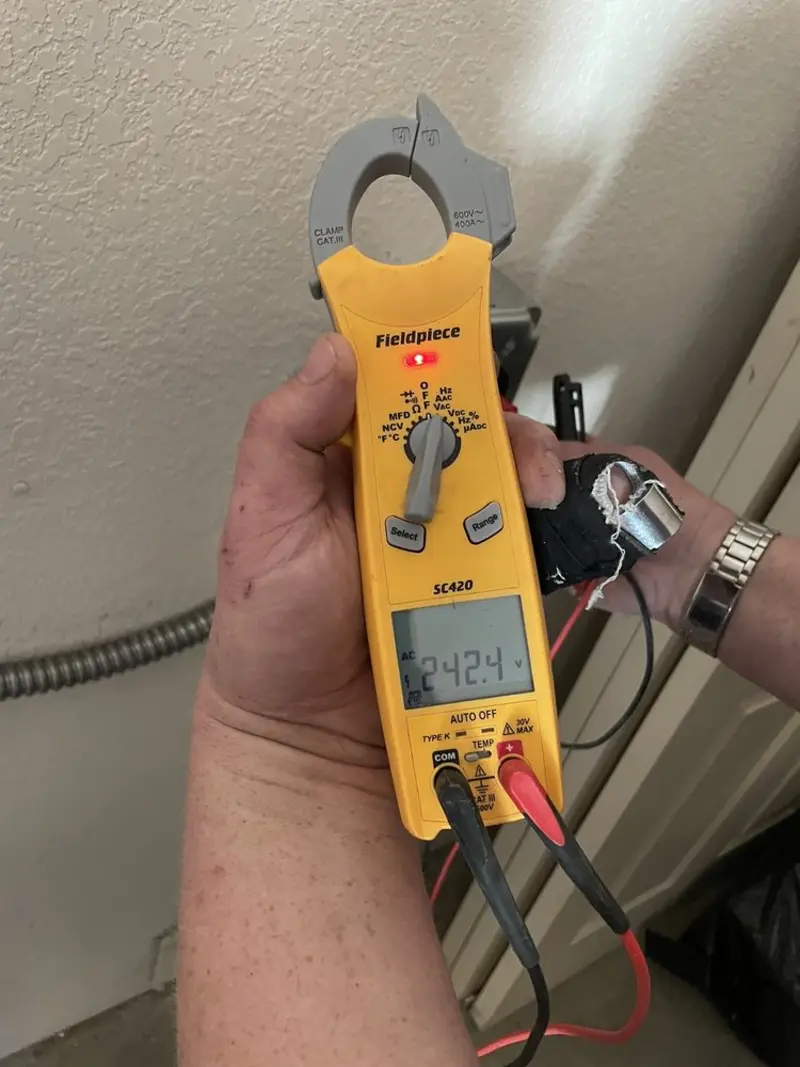 Voltage testing with clamp meter during Electrical Installation Services in La Riviera
